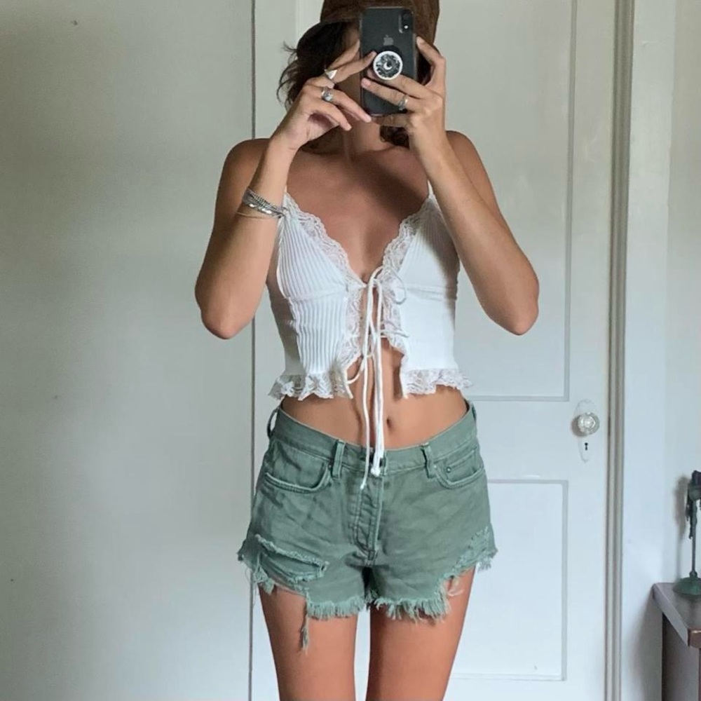 Free People green frayed denim shorts